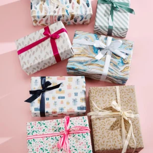 Geschenkpapier | Go Green - Nachhaltige Geschenkverpackung^DecoWoerner Nachhaltiges Kraftpapier Aus Zuckerrüben Mit Federn In Rosé & Gold – 50 M Geschenkpapier-Rolle mehrfarbig
